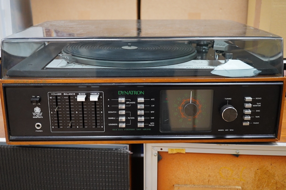 A Dynatron Goldring GL78 turntable with integral amplifier and tuner, made in Switzerland, together with a pair of Leak Sandwich 600 stereo speakers in teak cabinets, 65cm high
